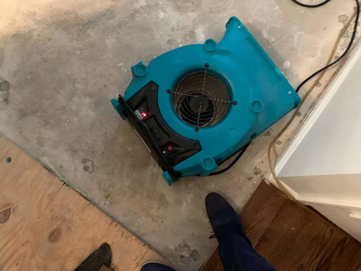 Air mover drying subfloor during Leak Detection & Repair in The Village of Indian Hill